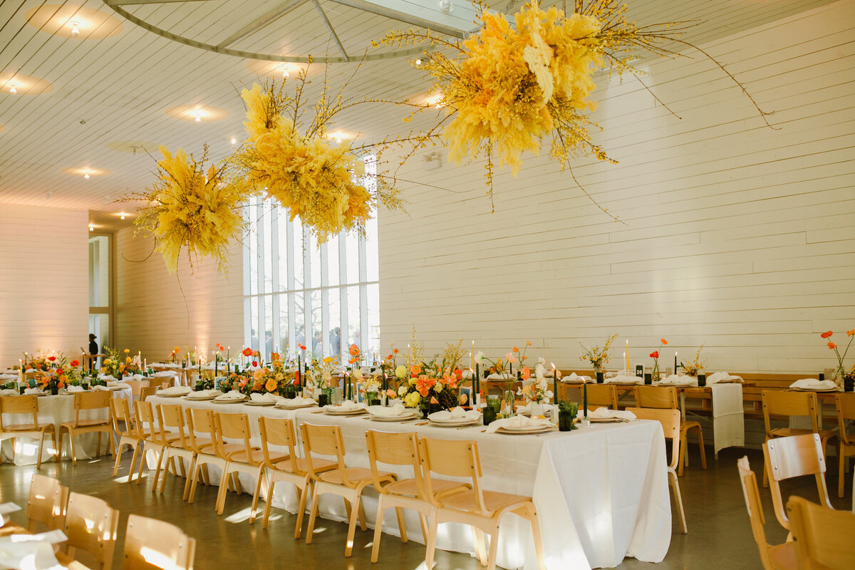 Wedding reception with yellow florals at Prospect House Austin