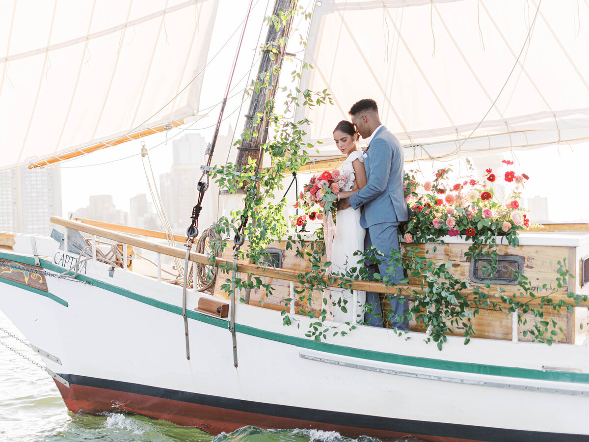 Kate-Murtaugh-Events-elopement-wedding-planner-Boston-Harbor-sailing-sail-boat-yacht-greenery-floral-installation-couple-water-view