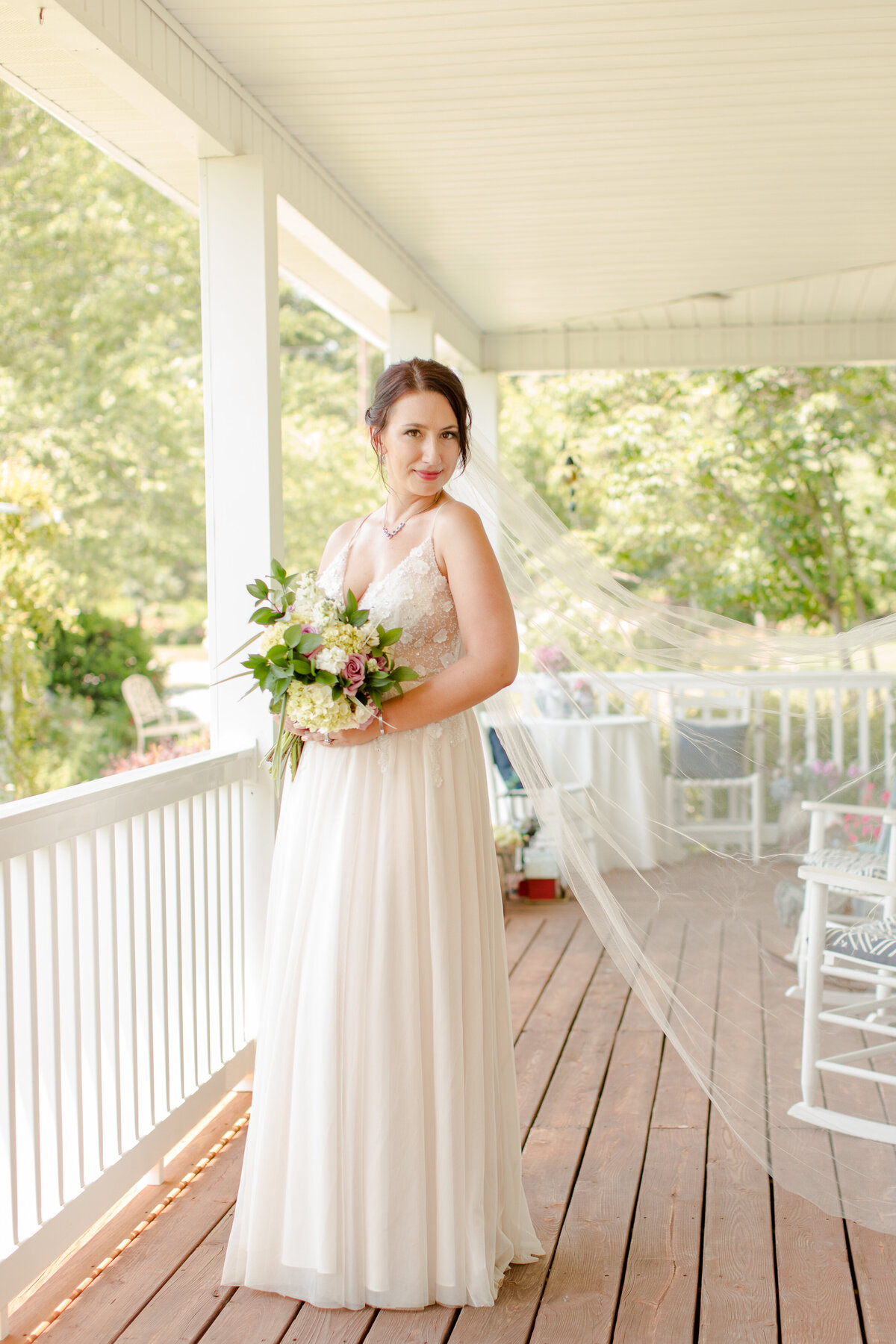 bride on a farm house porch