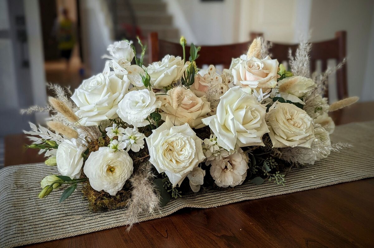 white funeral flowers with soft pink
