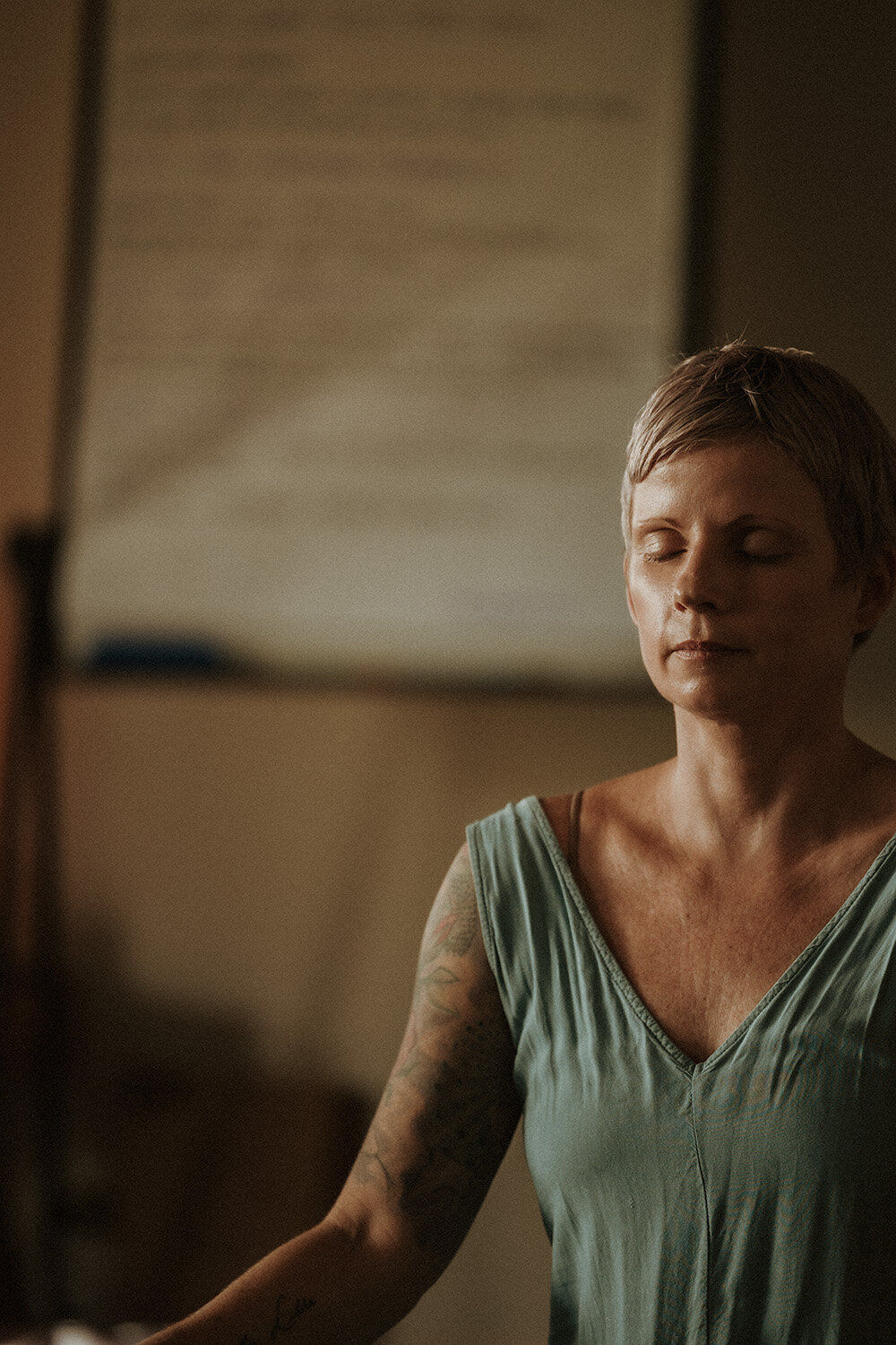 Yin yoga facilitator at her retreat meditating in gympie