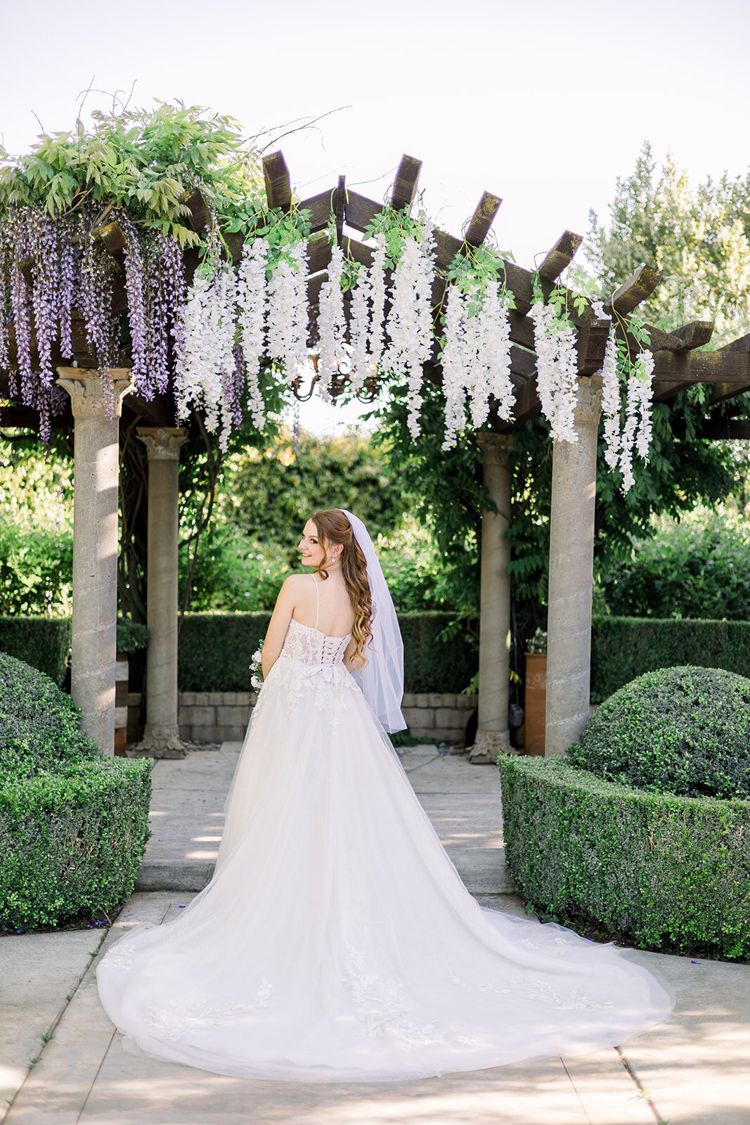 Bride shows off her wedding dress at Wolf Lakes Park