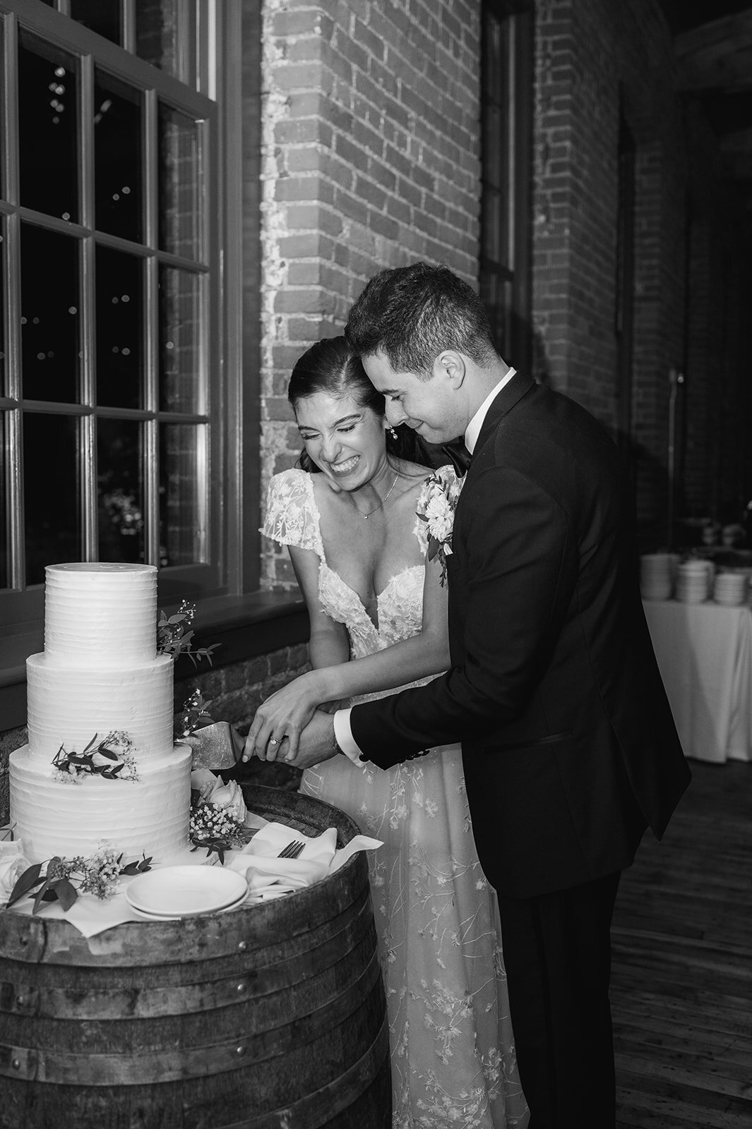 cake cutting between bride and groom