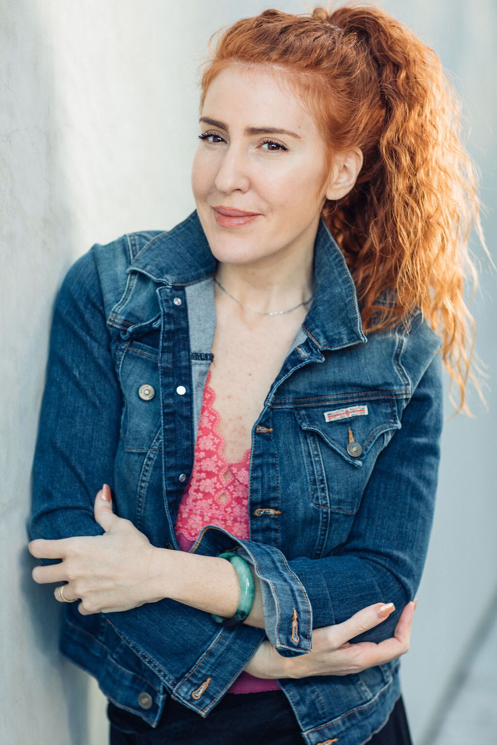 Headshot Photograph Of Woman In Blue Denim Jacket And Inner Pink Blouse Los Angeles