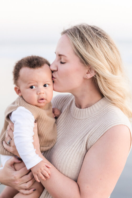 family-portrait-mother-kissing-infant-son