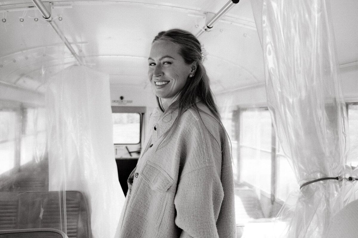 adirondack-mountain-wedding-06-bride-enjoying-a-quiet-moment-in-preparation-area-with-soft-natural-light-at-adirondack-mountain-wedding-jenny-fu-studio