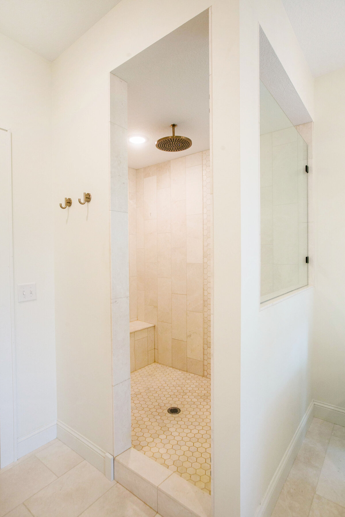 Custom bathroom with soaking tub, double vanity, and walk-in shower in Otsego custom home