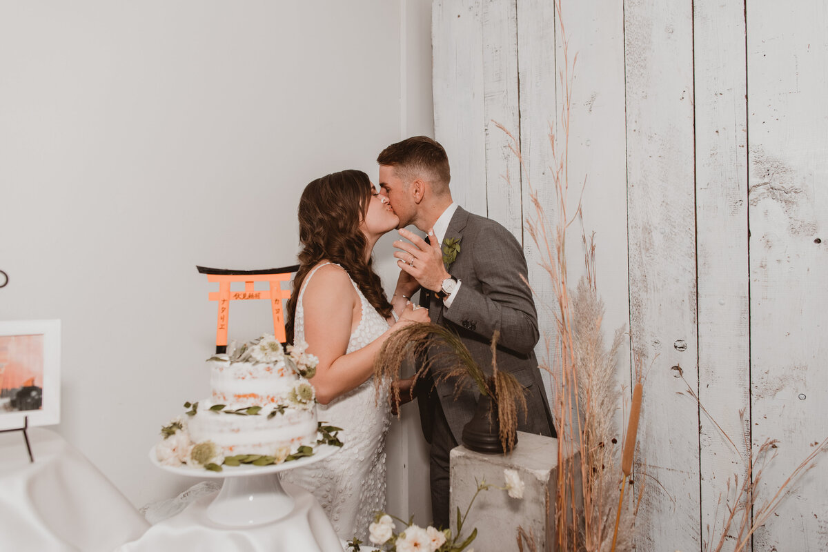 Bride and groom cut their wedding cake at Blanc Denver.