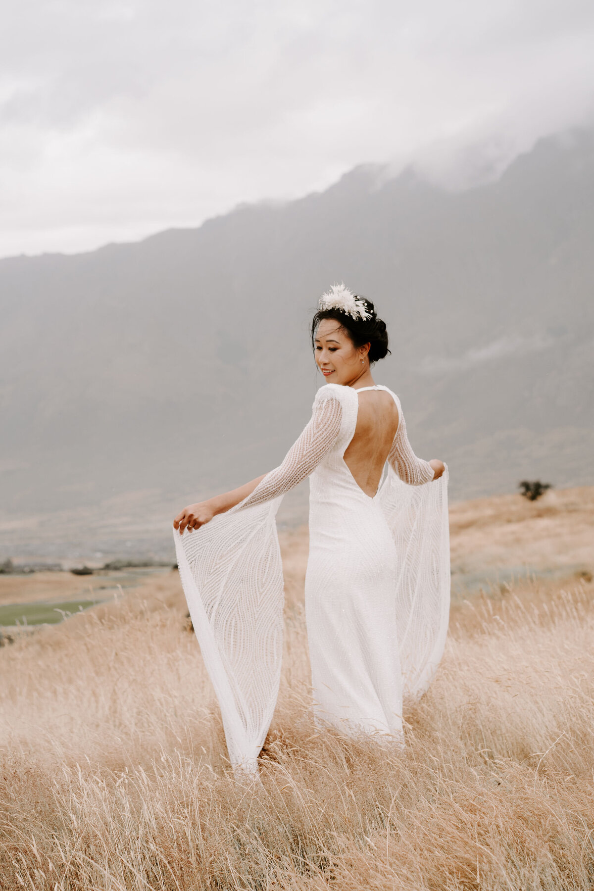 The Vase Floral Co - bride in Queenstown mountains wearing floral crown