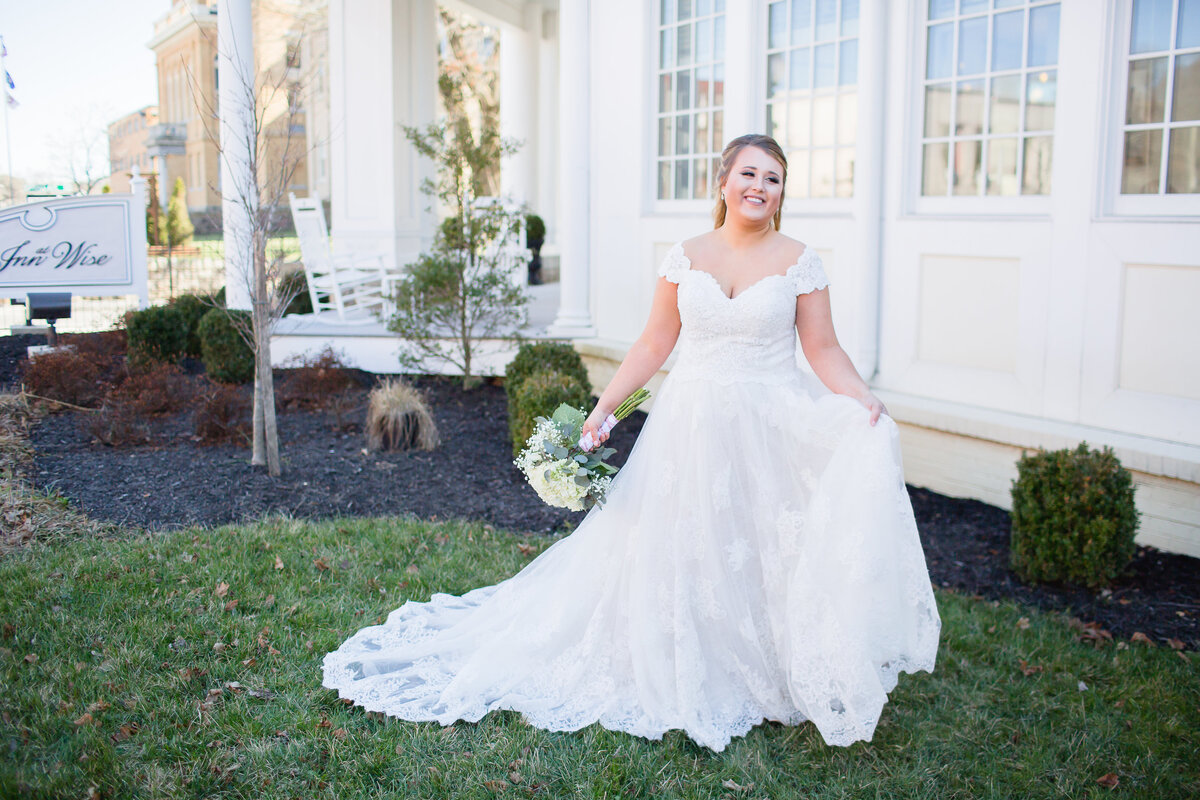 Bride poses for portraits on her wedding day in Virginia