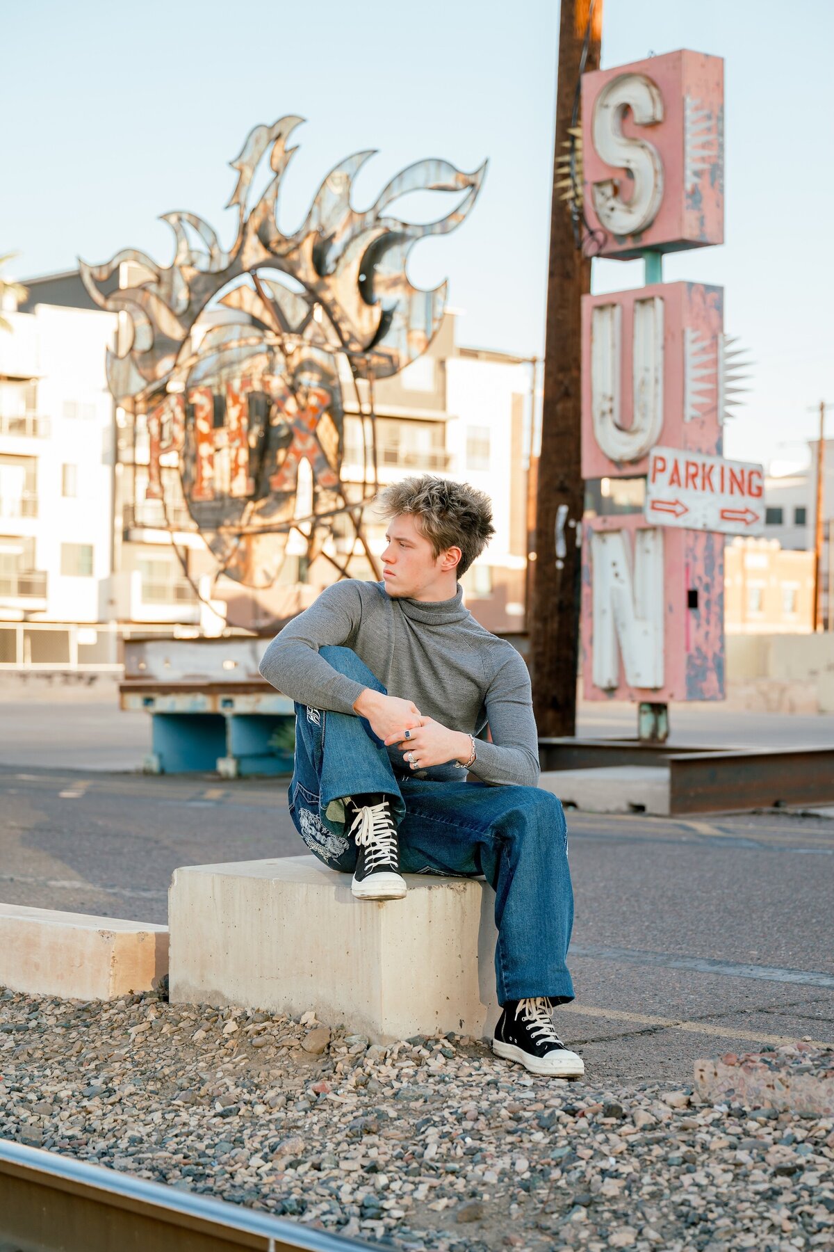 senior boy posing in downtown phoenix 