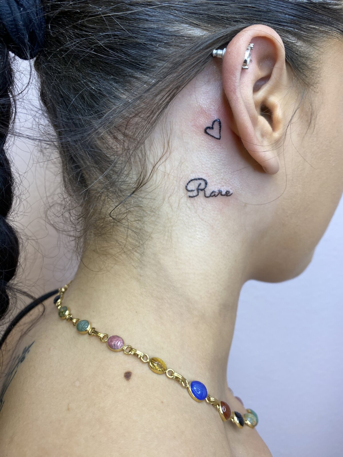 heart behind ear tattoo