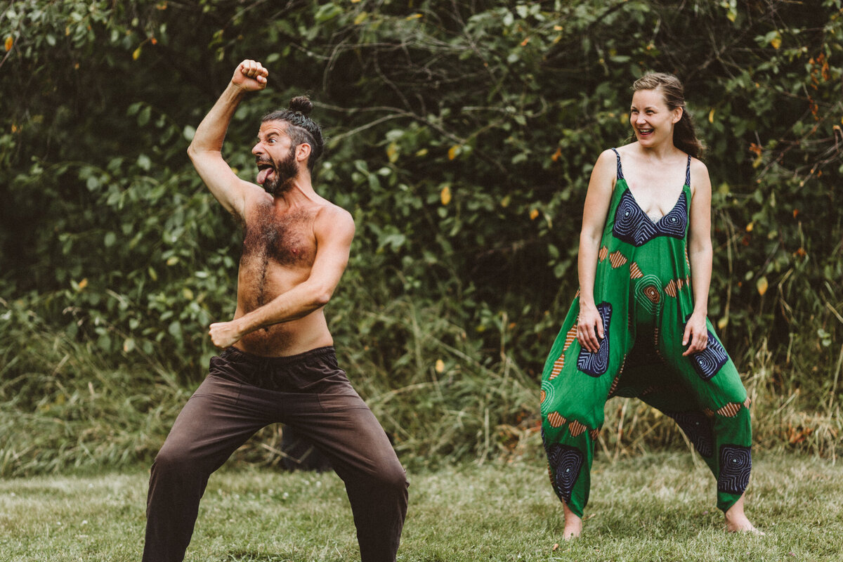 man pulling funny face in field 