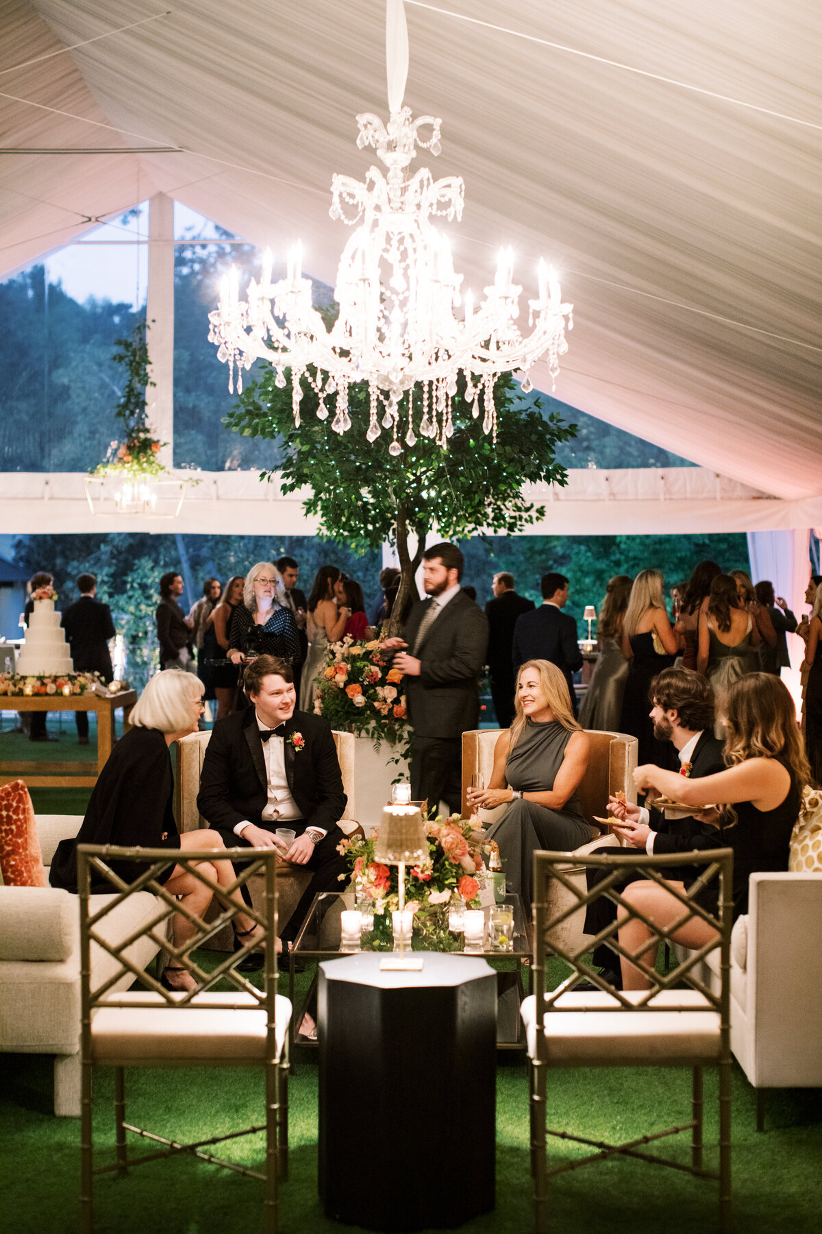 Wedding guests in tented reception
