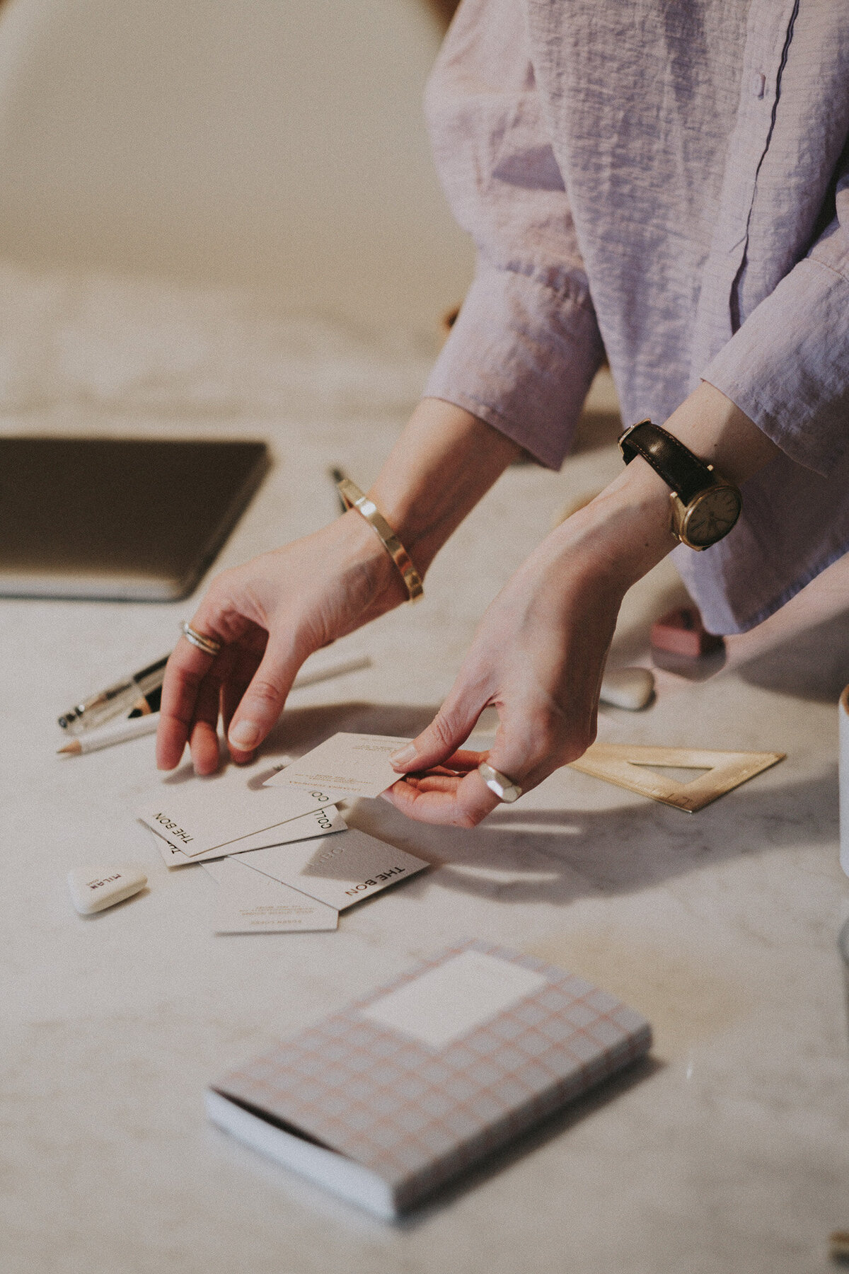 Womens Hands Moving Business Cards Marble Table