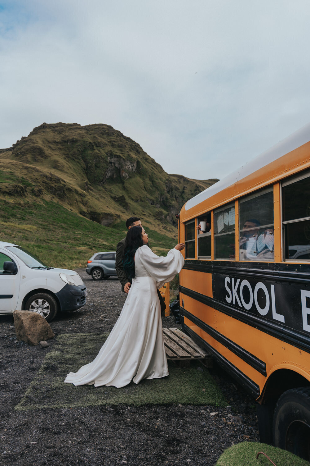 Bride grabs her coffee from the school bus cafe 