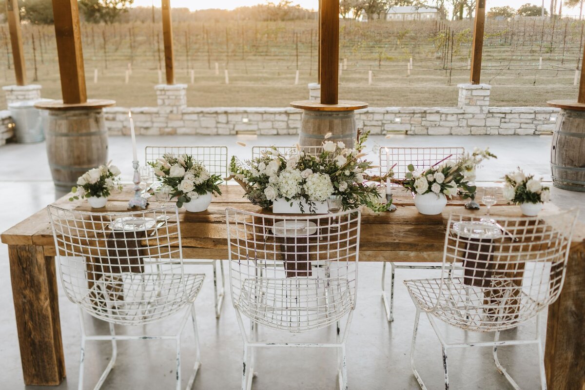 decorative table decorated with white florals and place setting