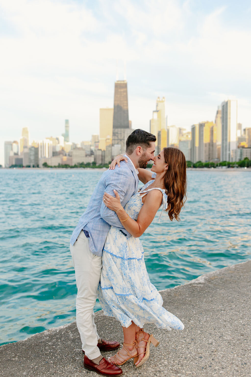 An engagement photography session at The Wrigley Building and North Ave Beach in Chicago, Illinois - 26