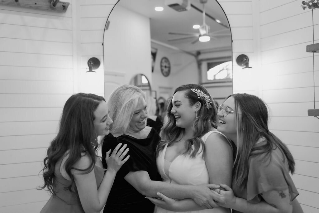 while eloping to gatlinburg bride reunites with her mother, grandmother and sister in her bridal suite before the wedding ceremony