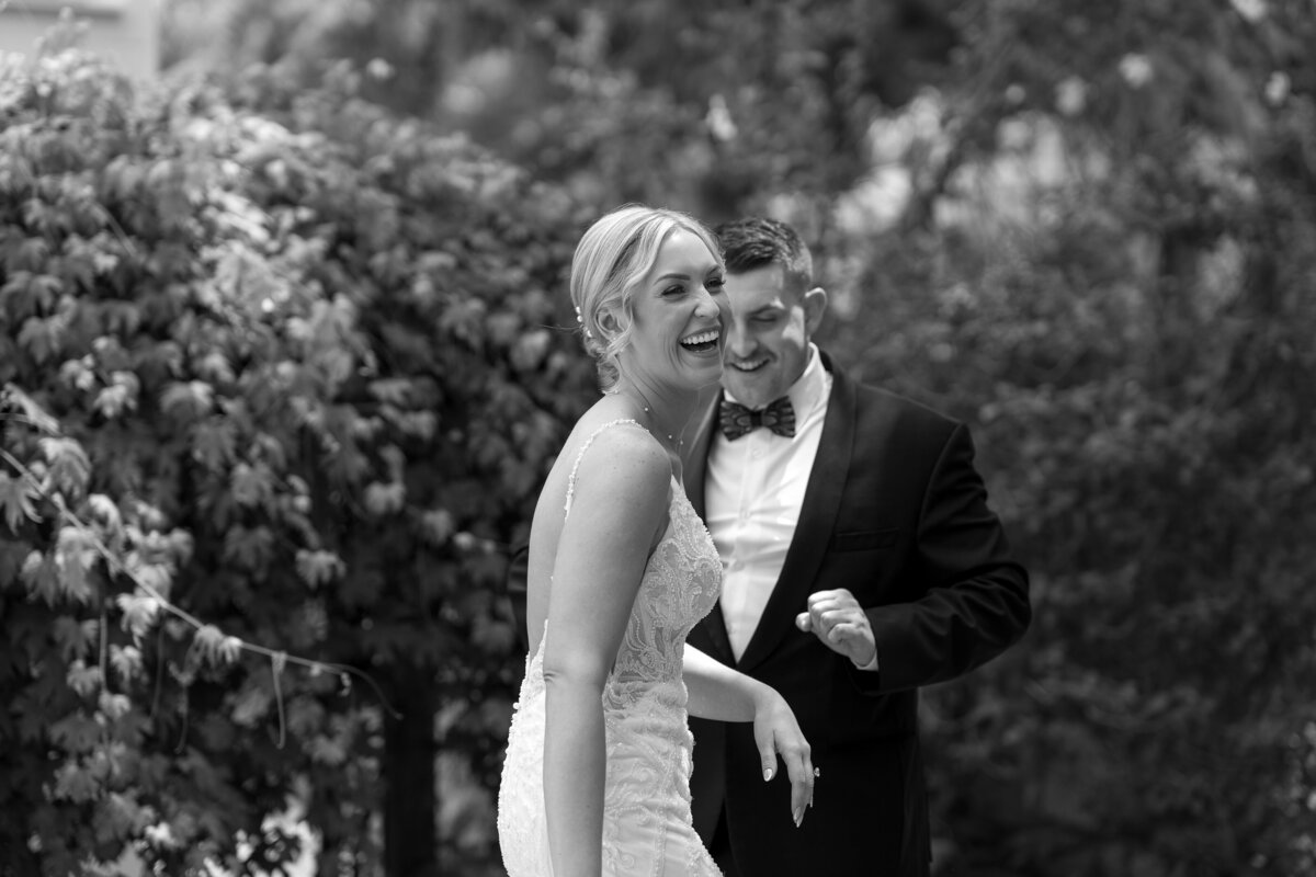 Bride and Groom laughing and smiling for wedding film photography taken by Shelby Ann Photos