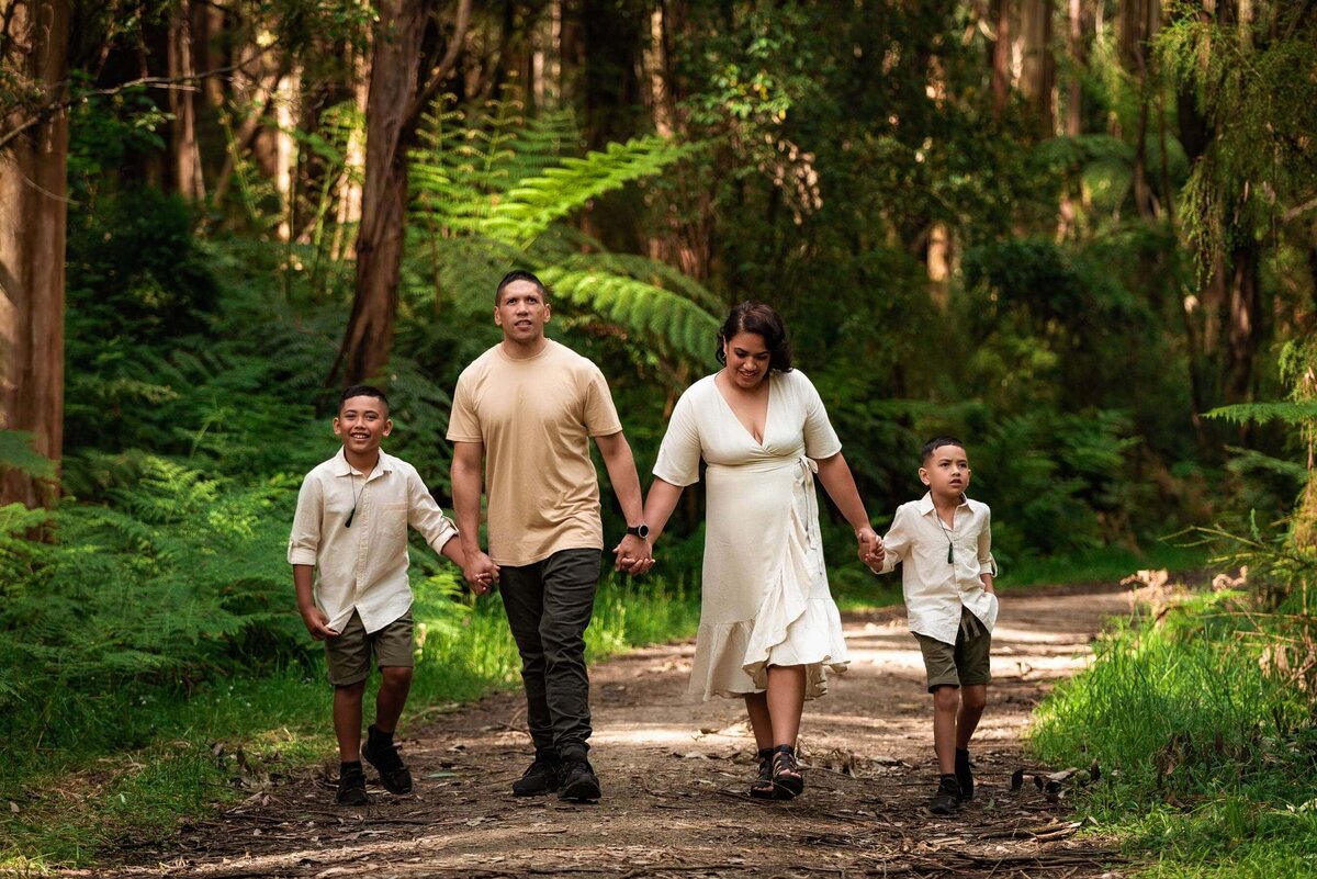 family of 4 walking in forest at Kallista