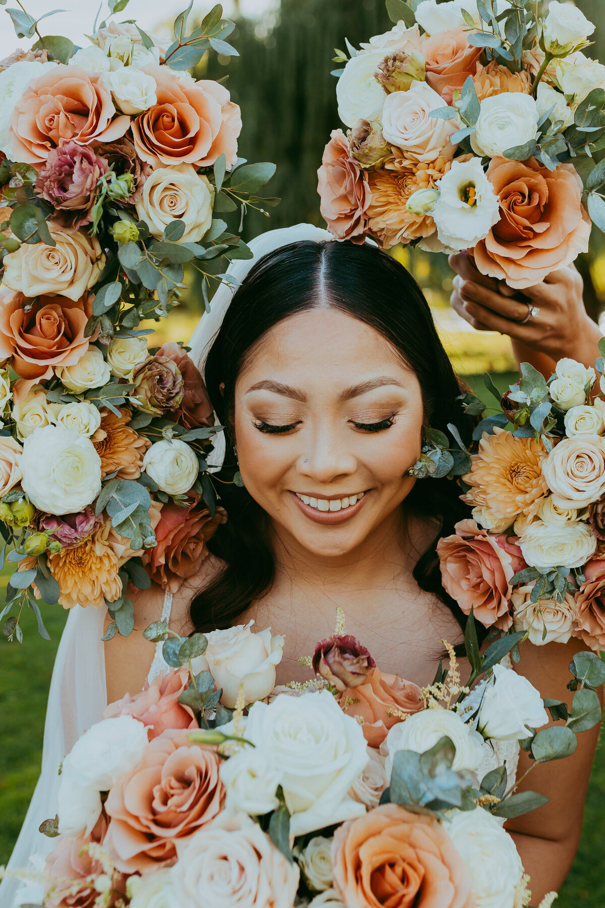 bride surrounded by florals for wedding photo in sedona