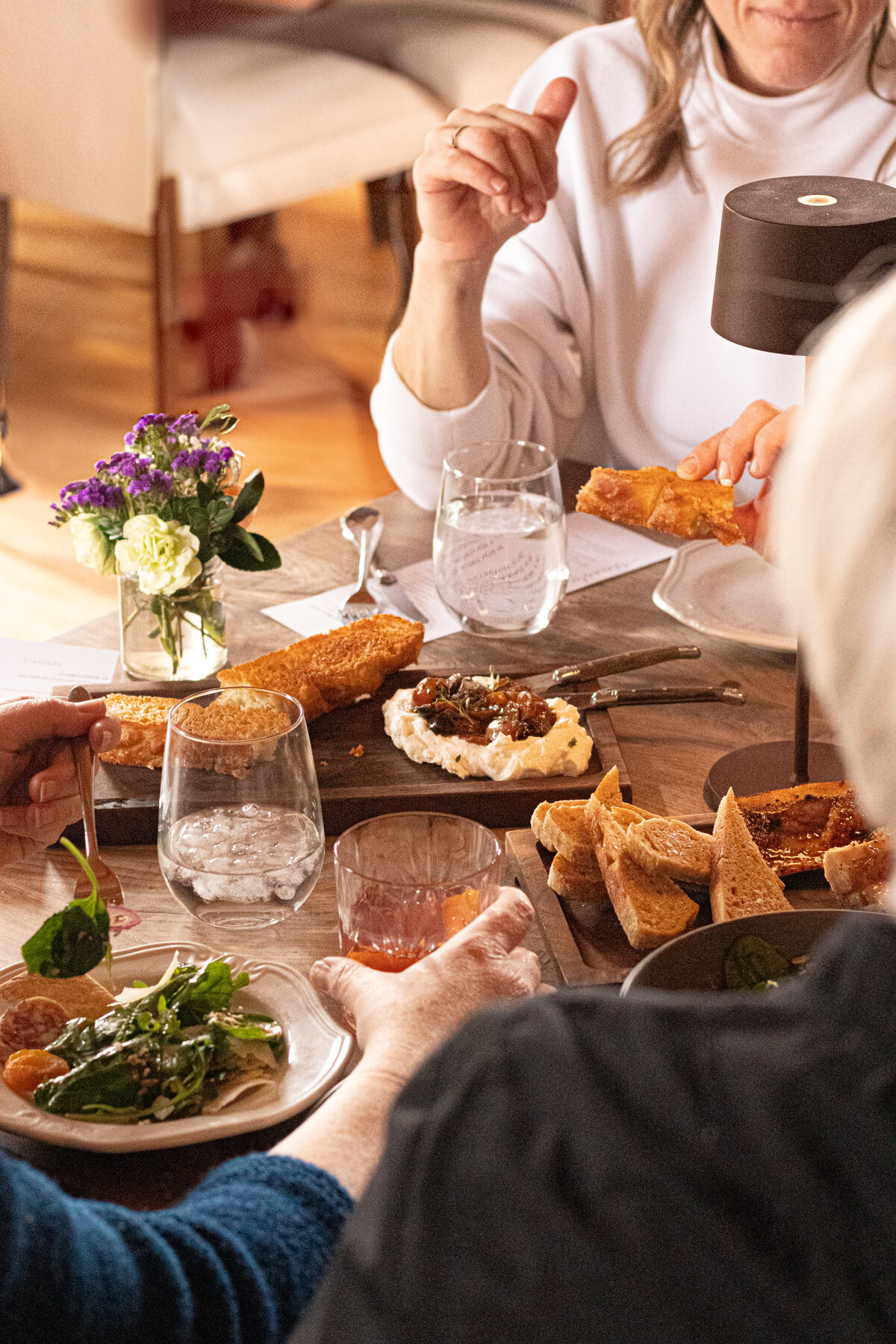 elevated food laid out on a restaurant dining table
