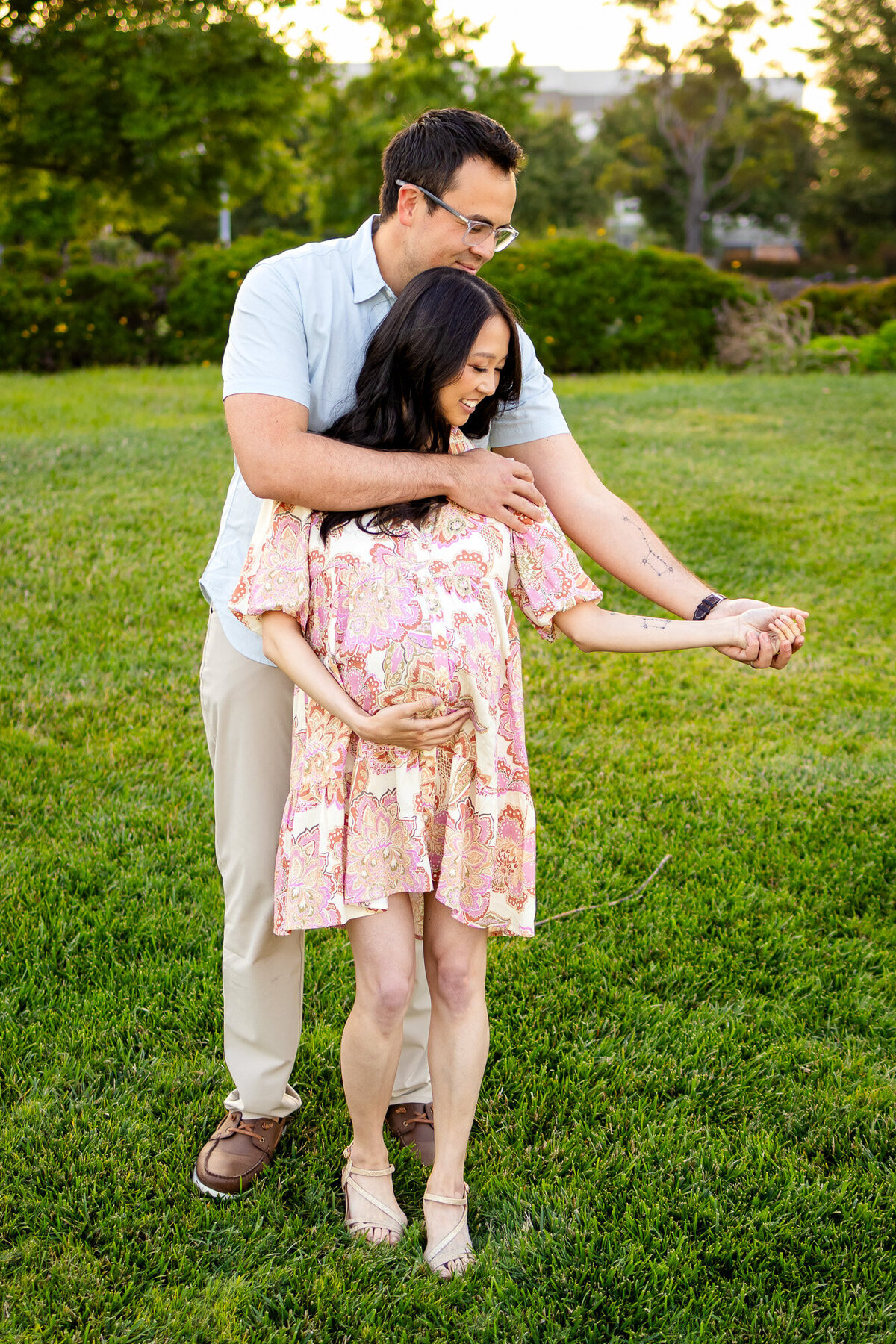 Husband embracing his pregnant wife from behind in a golden hour maternity shoot — Bay Area Maternity Portfolio - Ellobelle Photography