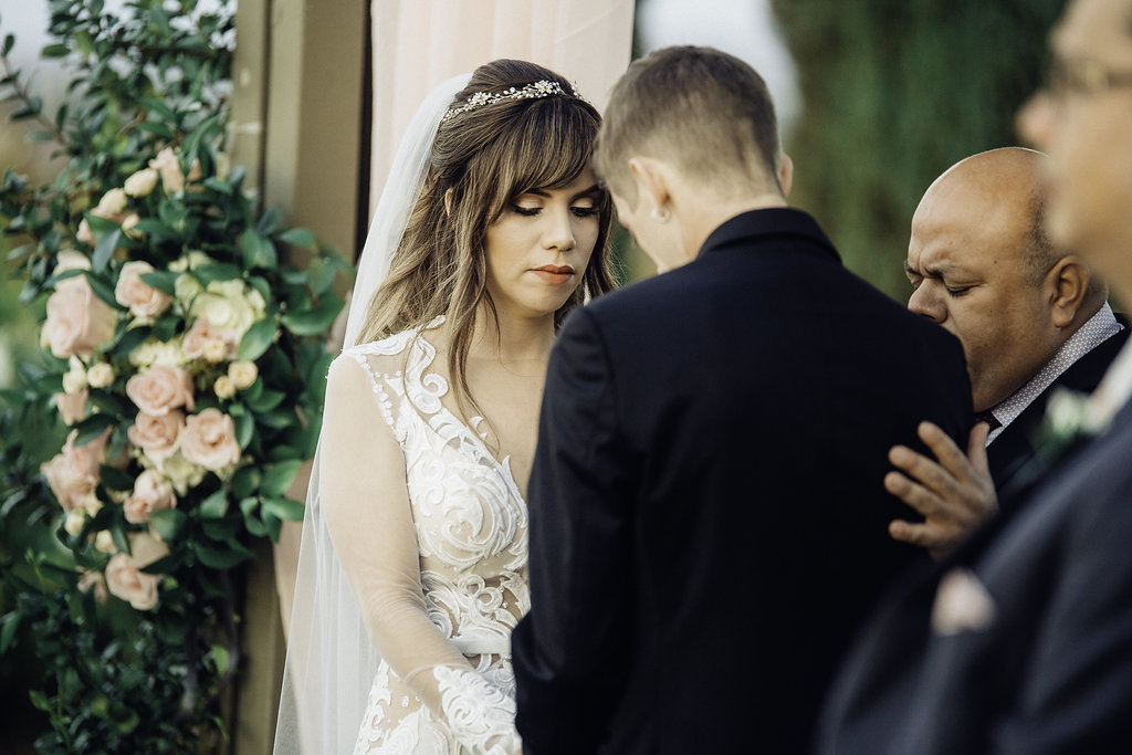 Wedding Photograph Of Bride And Groom Bowing Their Heads To Each Other Los Angeles