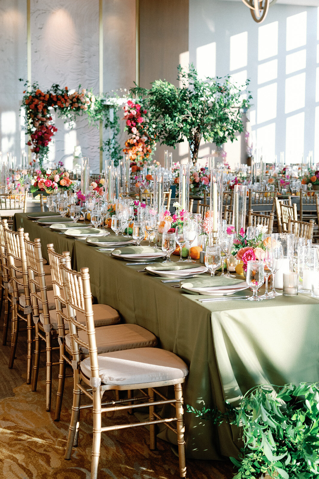 Elegant wedding reception with colorful floral centerpieces