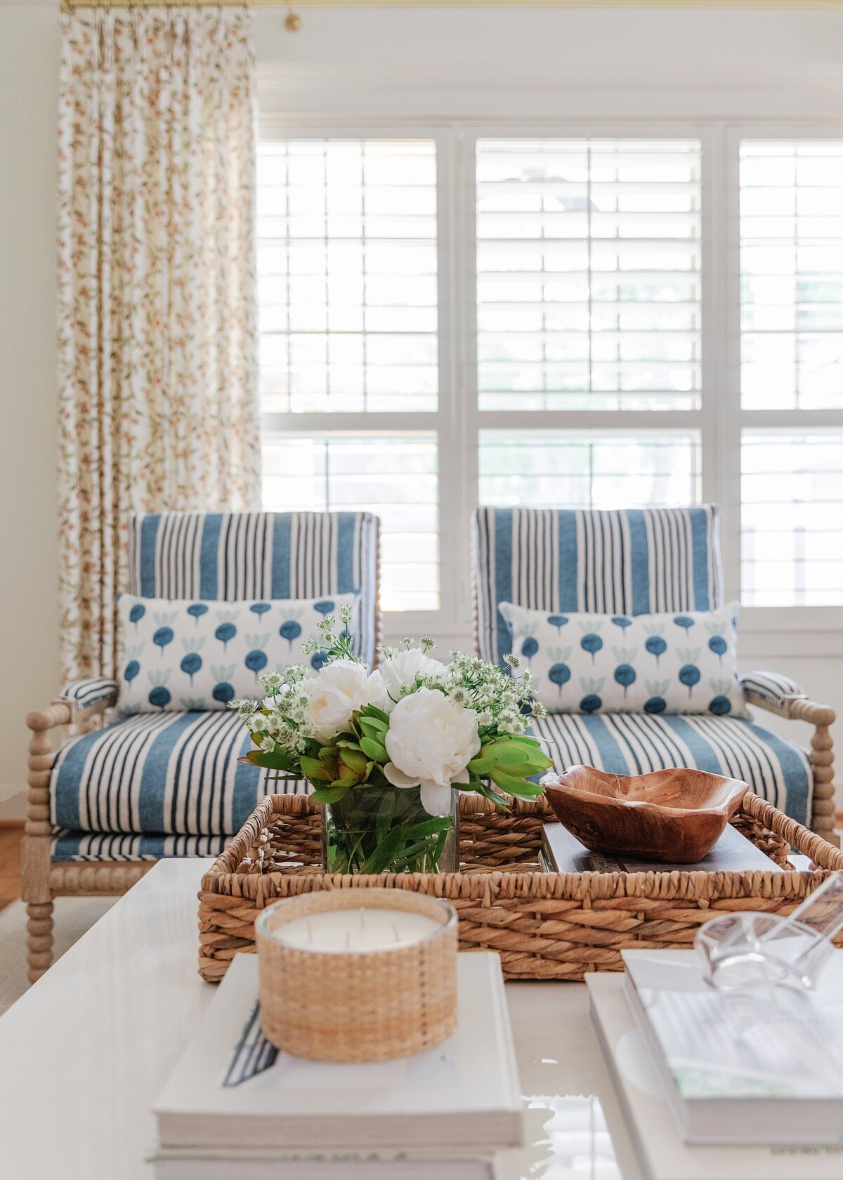 oyster creek studios oak forest remodel striped arm chairs with white cushions and wicker basket in living room