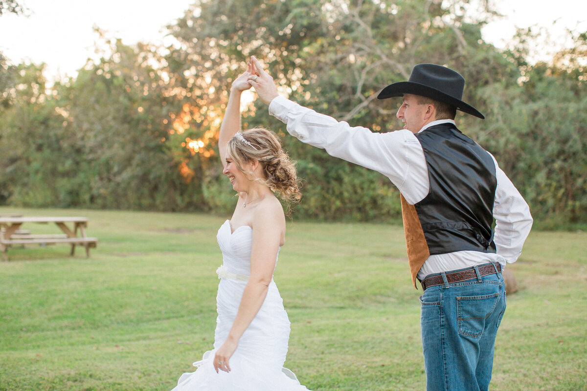 A bride and groom dancing in the last rays of sunlight on their wedding day. Captured by Stephanie Eddy, Colorado wedding photographer