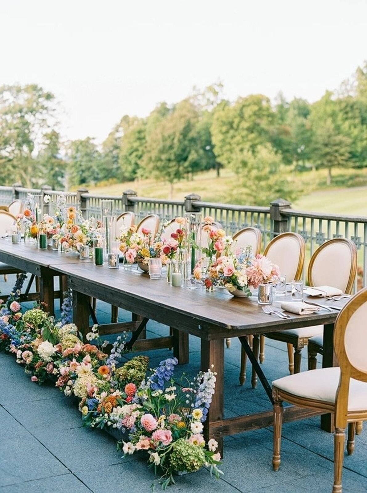 Wedding reception table with lush floral arrangements
