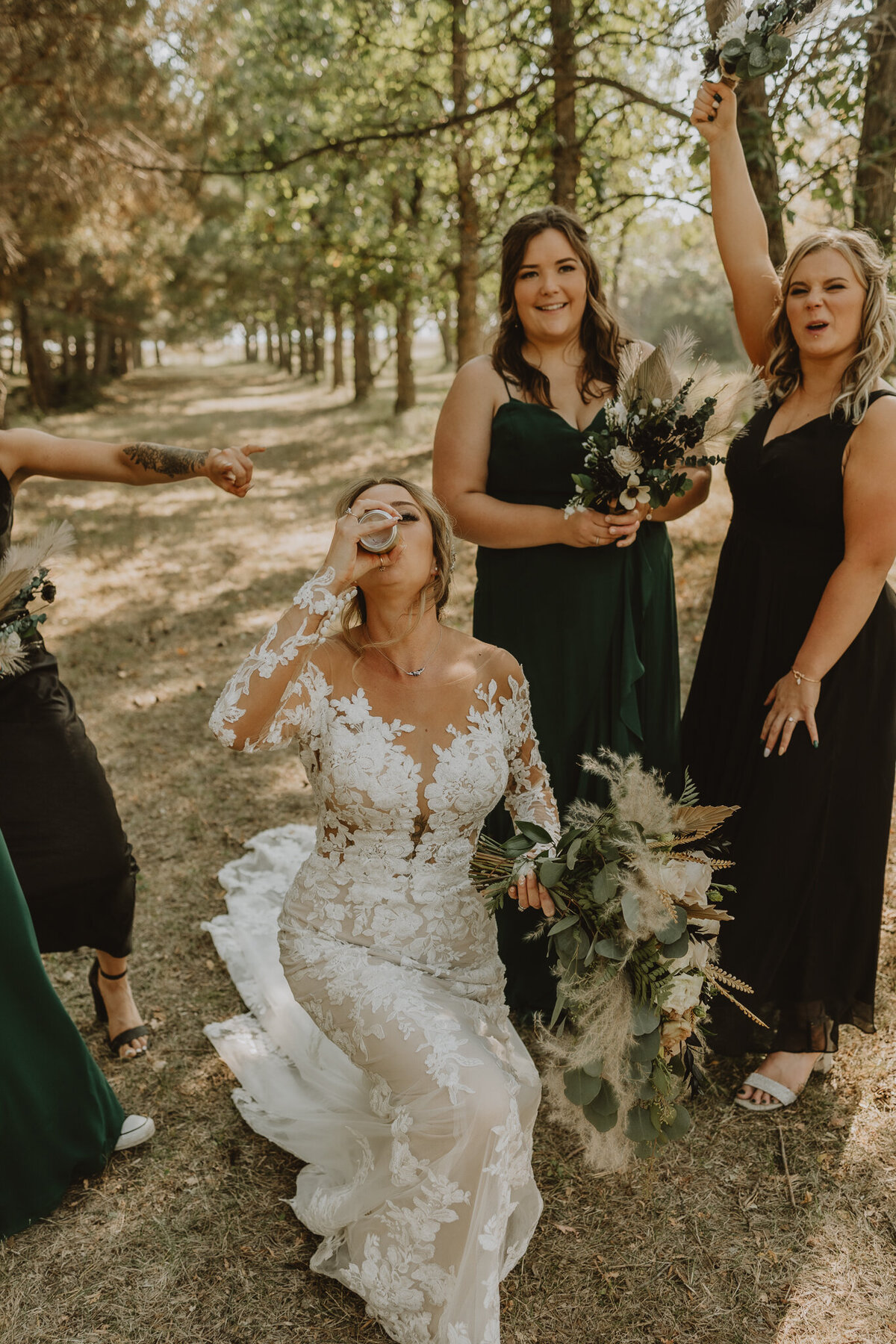 Bride getting down on knee and chugging a drink