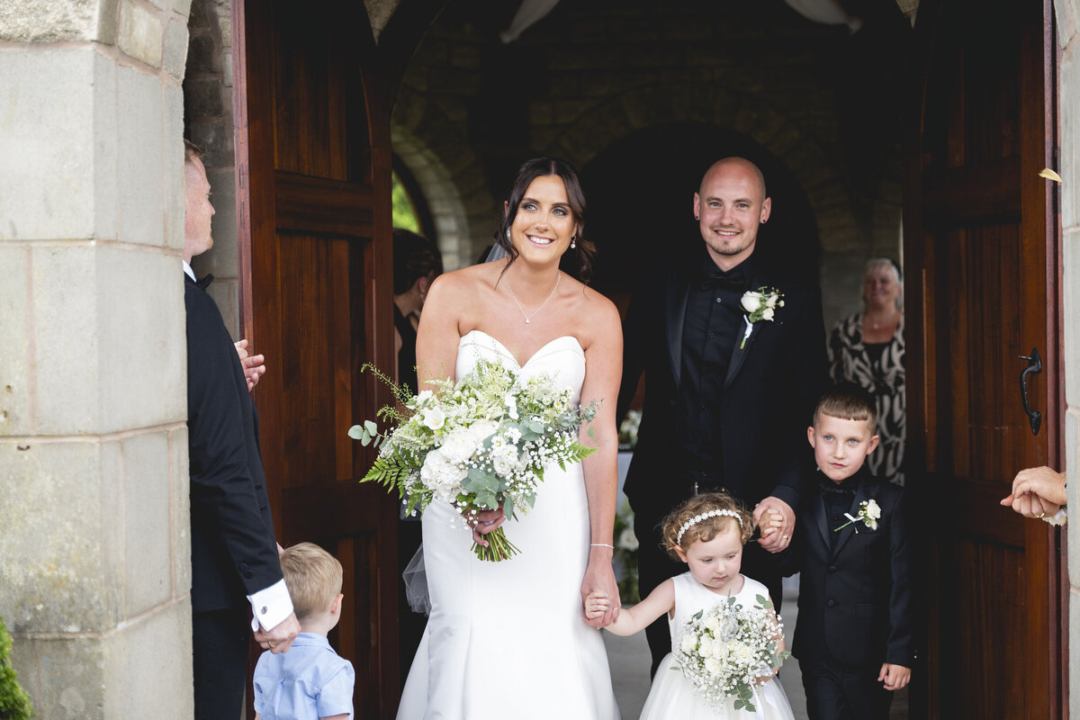 The family walking out from their ceremony