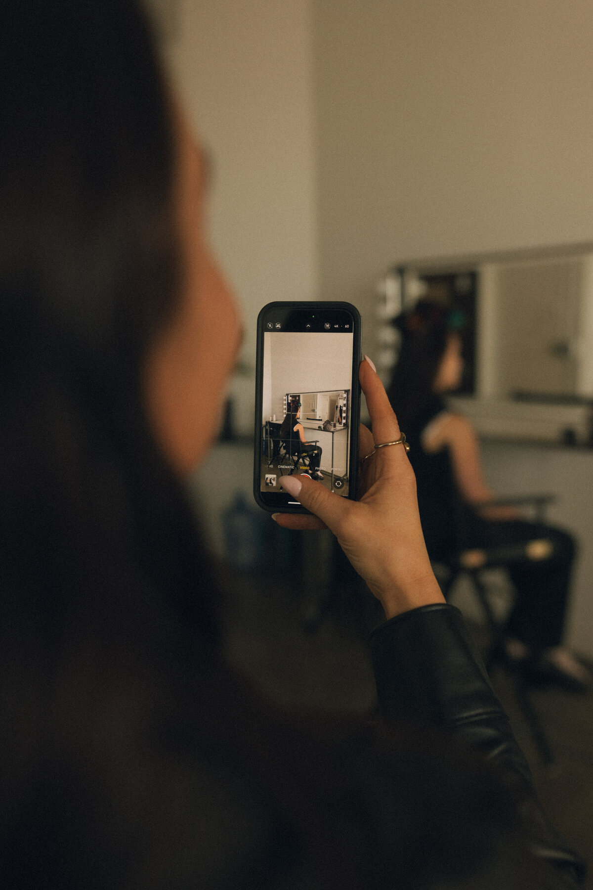 Syd filming content on her phone