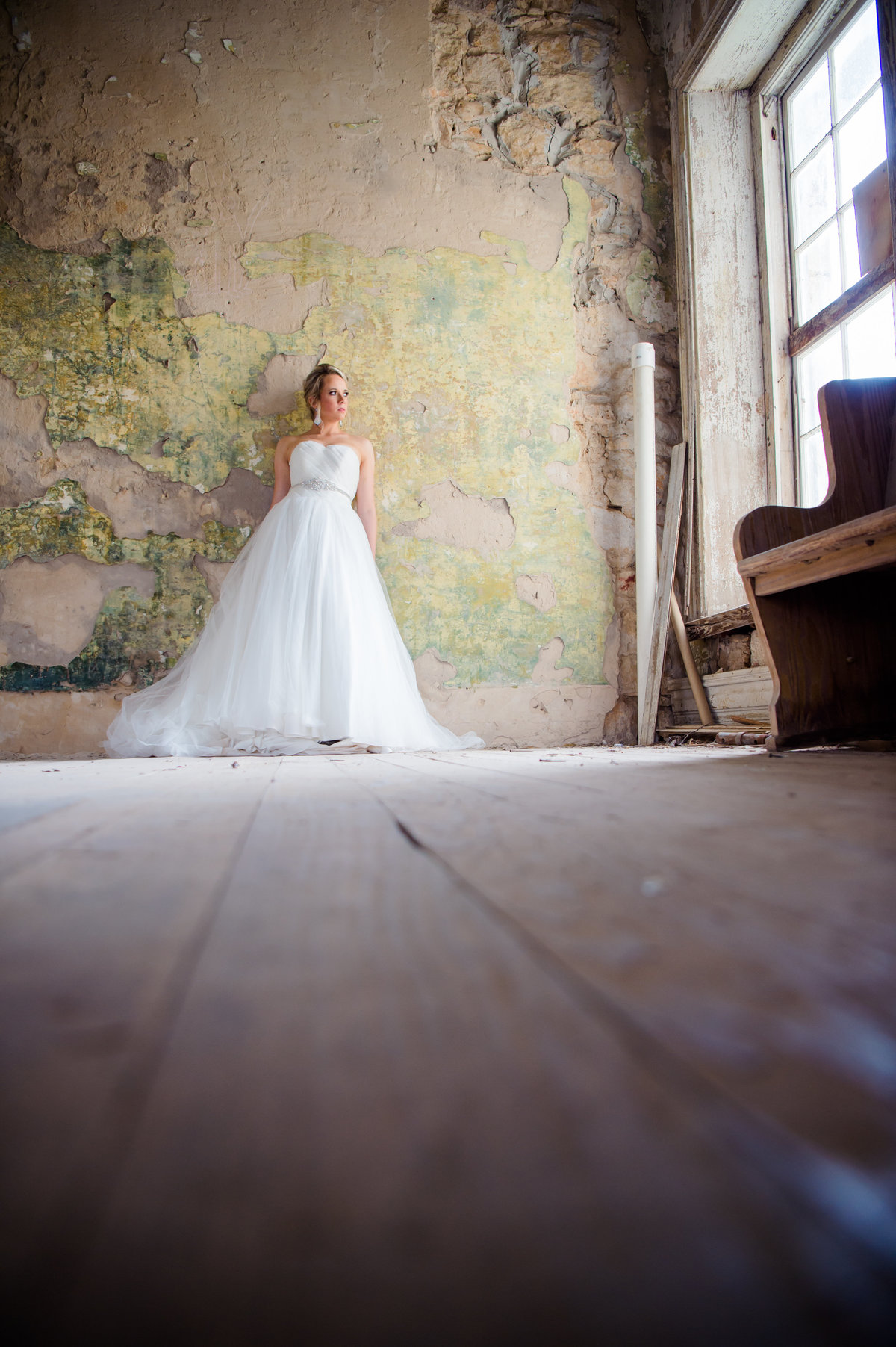 Bridal photo in run down house by Brittany Barclay Photography