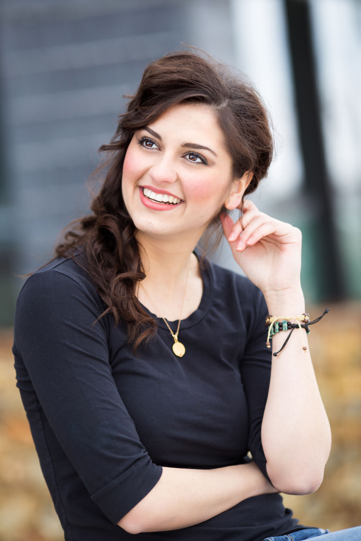 Senior portrait of girl posing in black shirt at Daybreak, Utah.