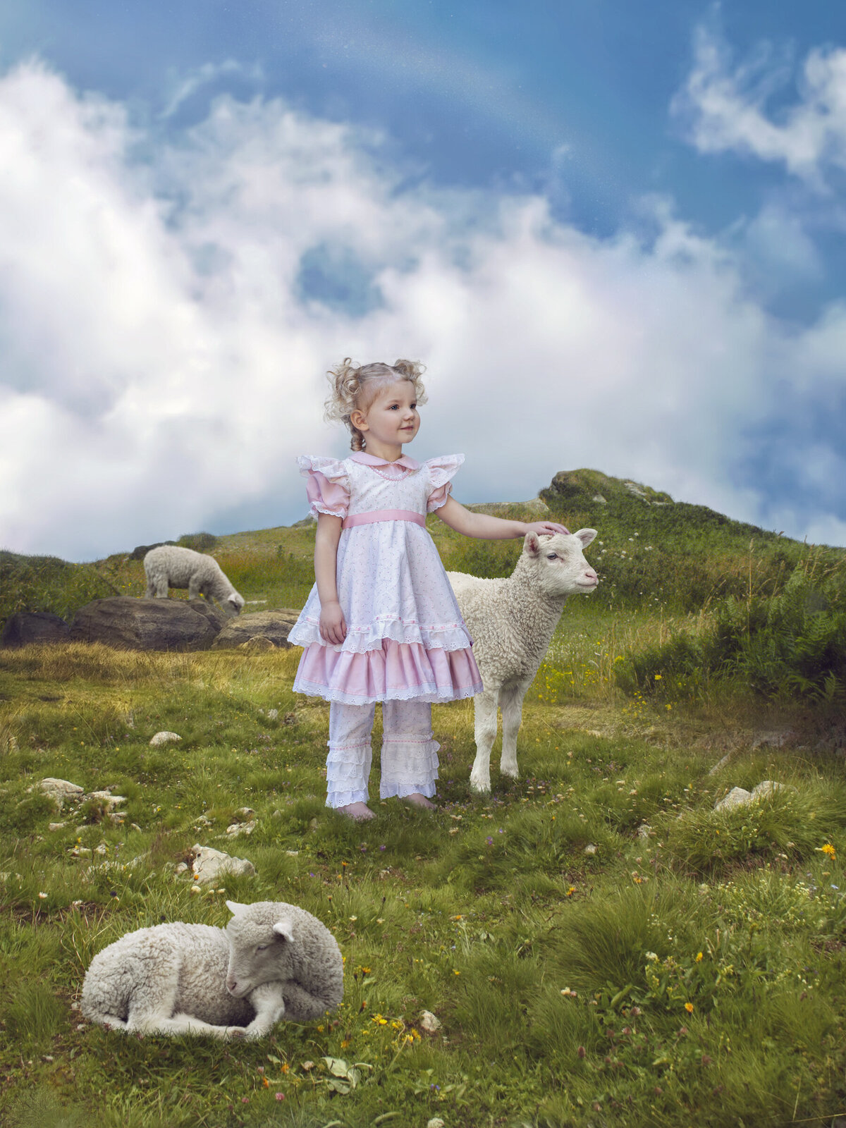 girl standing on grassy hill with sheep dressed as little bo-peep