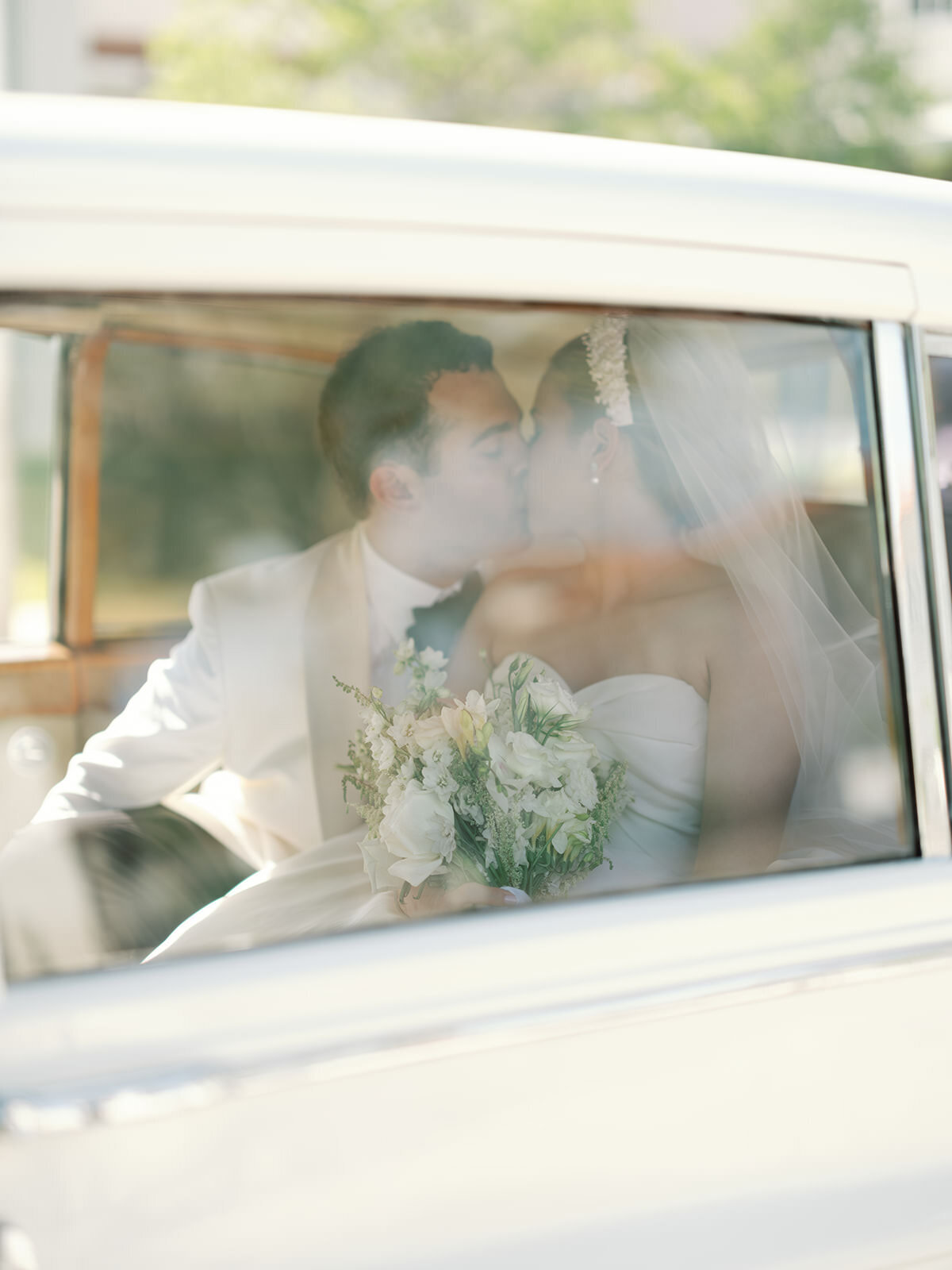 bride-groom-kissing-car-3GF-W