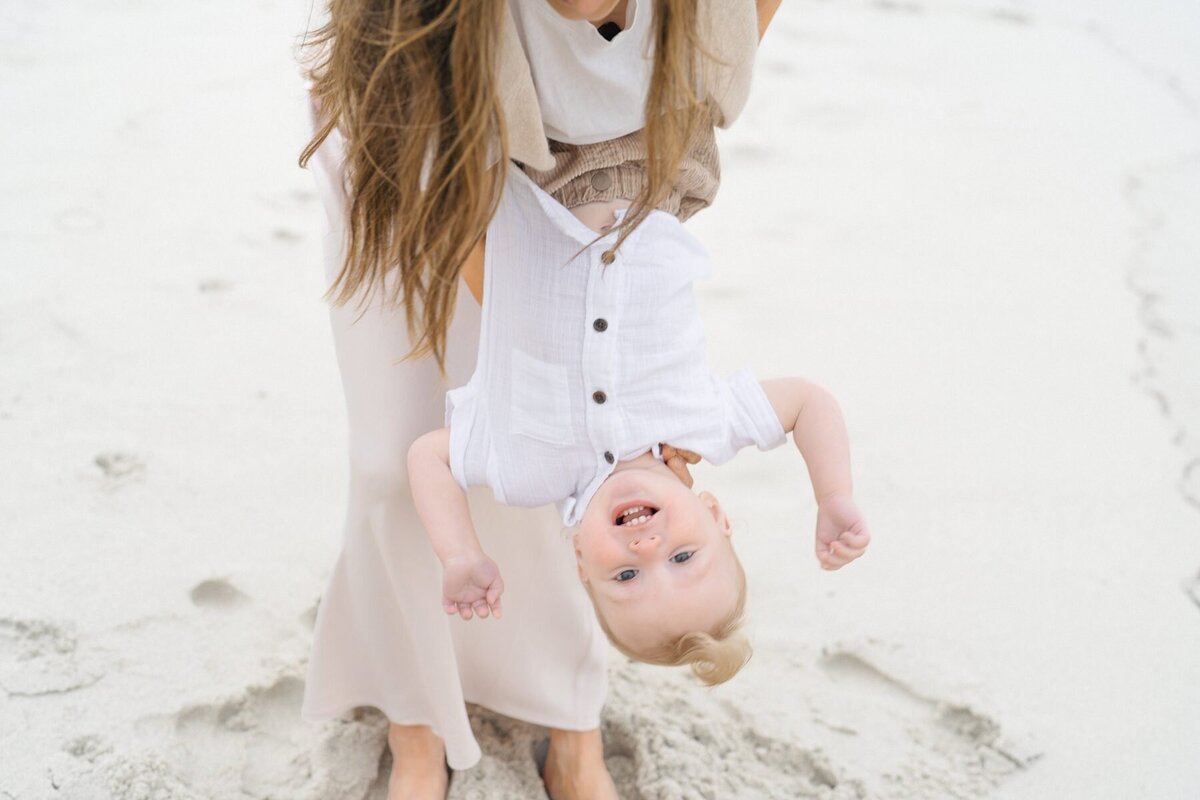 San Diego beach photoshoot with happy baby boy at Windansea Beach.