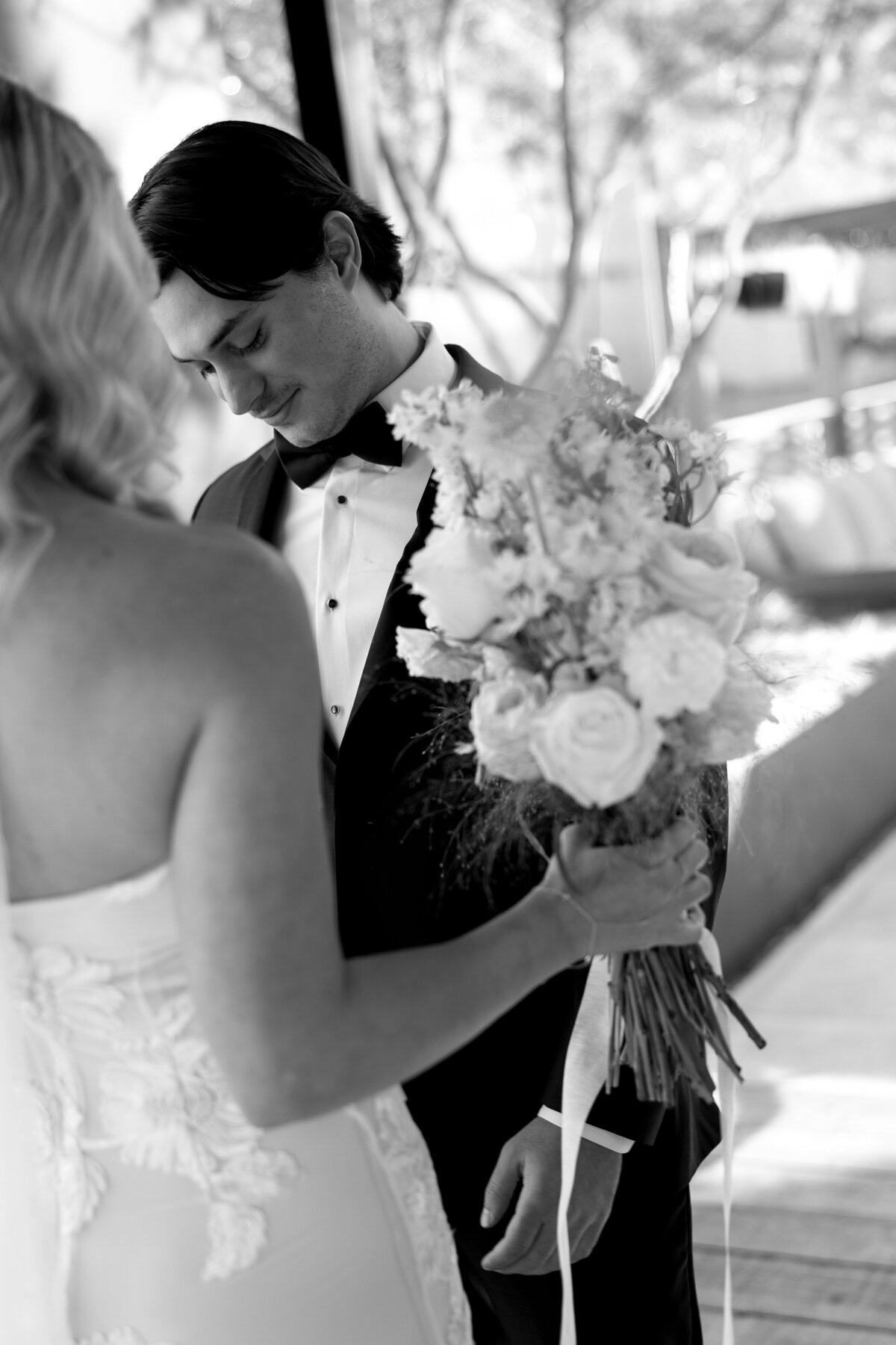 A groom getting emotional seeing his bride for the first time at Thompson Hotel in Austin.