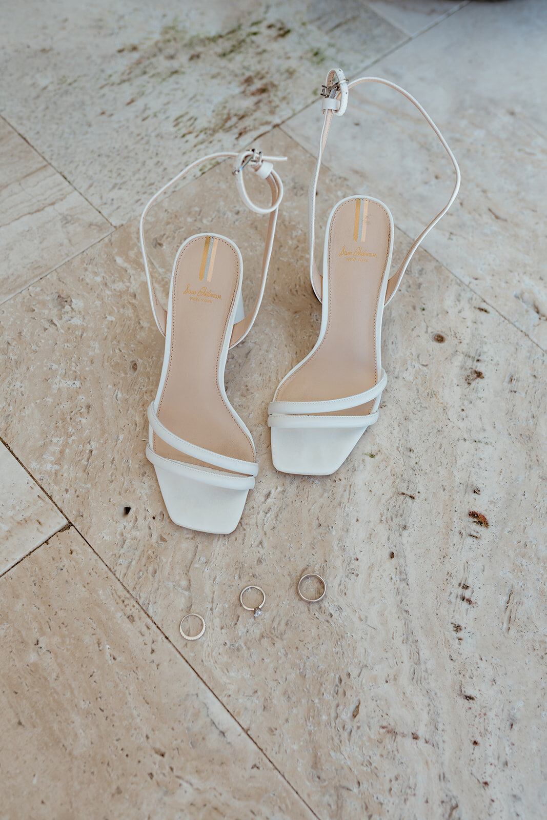 Wedding shoes and wedding bands make a minimally beautiful flatlay photo 