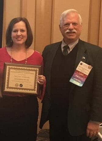 Amelia receiving the Van L. Lawrence Fellowship