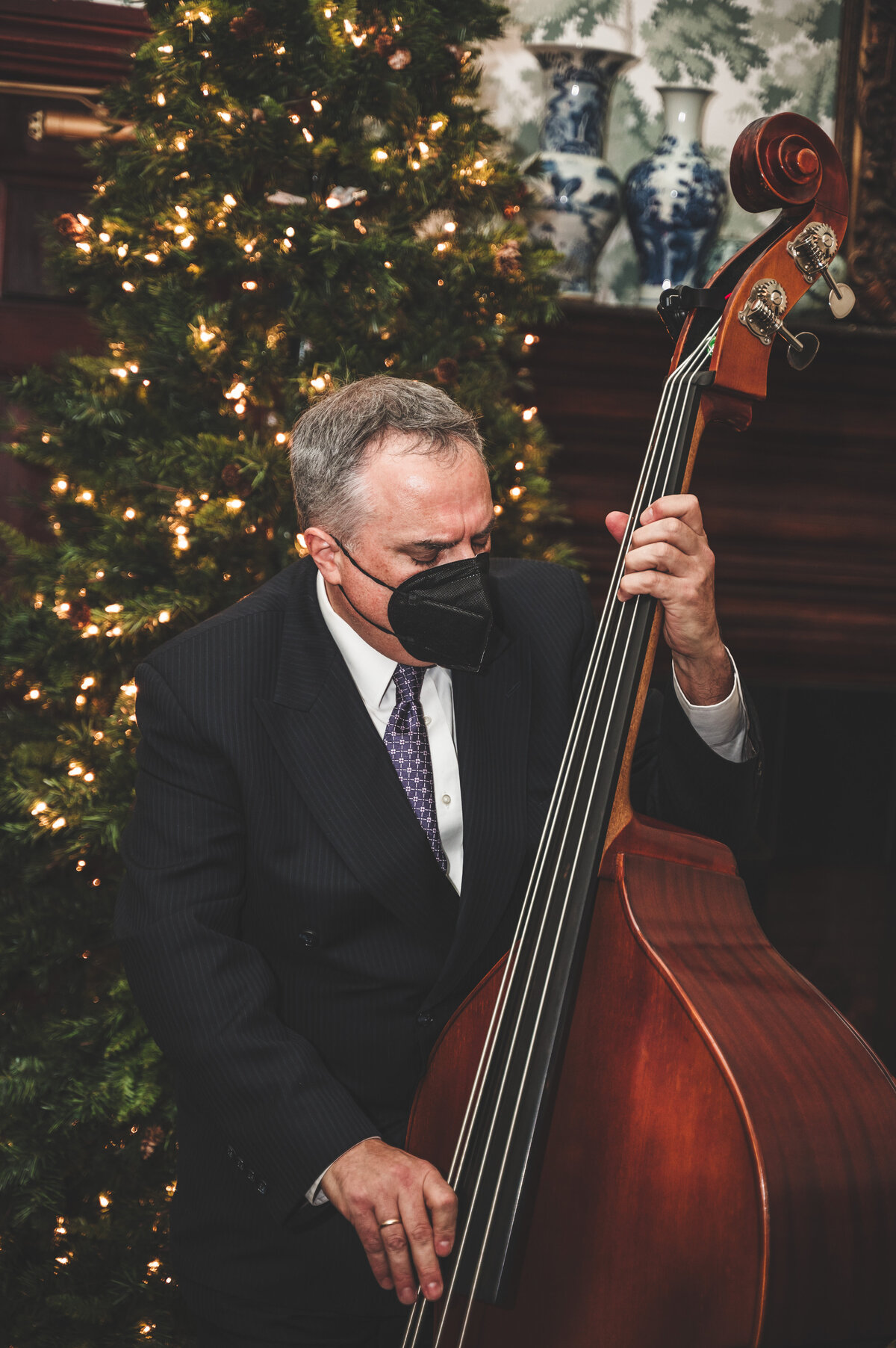 Bassist playing jazz music at wedding cocktail hour at the Heritage Club in Bethpage