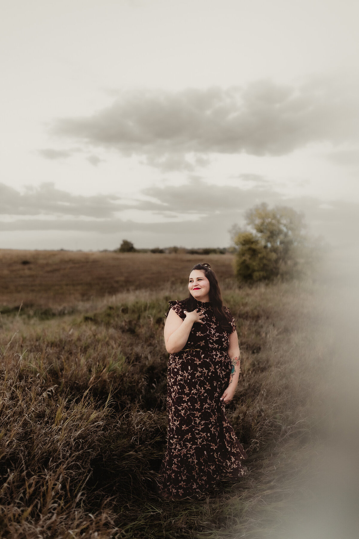 portrait of woman in brown floral dress with brown hair