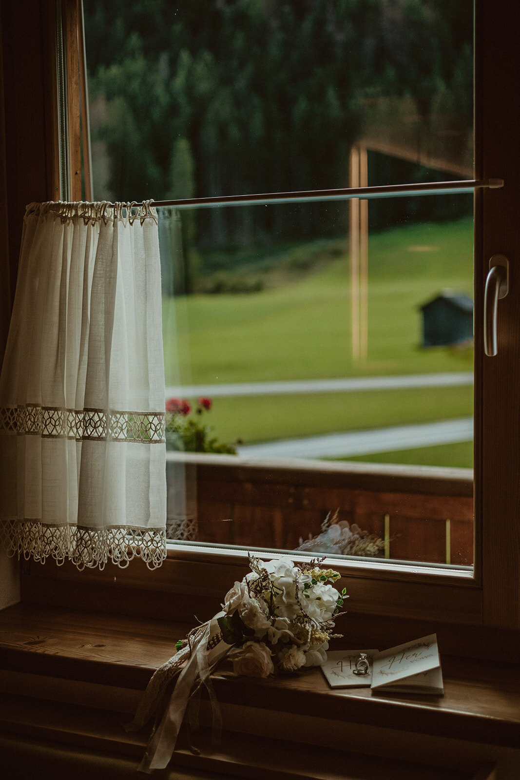 wedding florals against window 