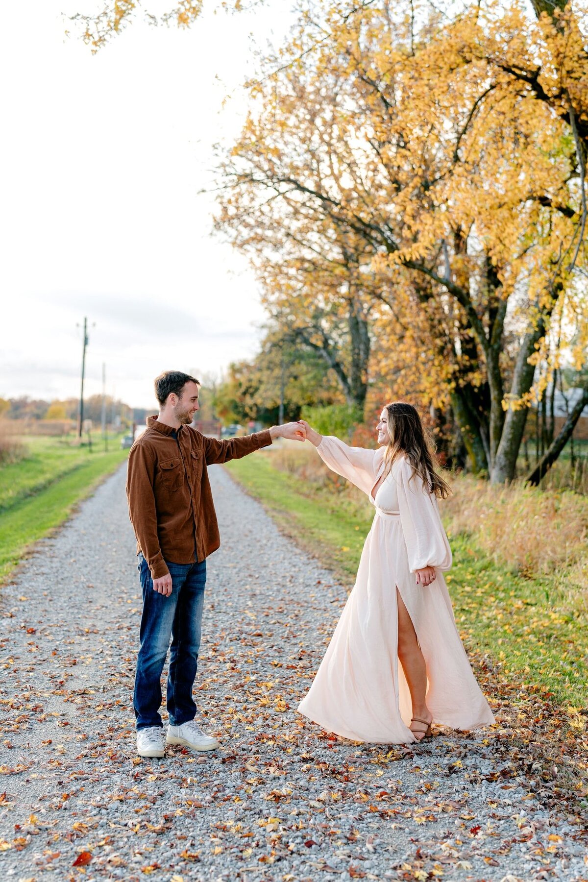 dancing-yellow-fall-tree-couple-session