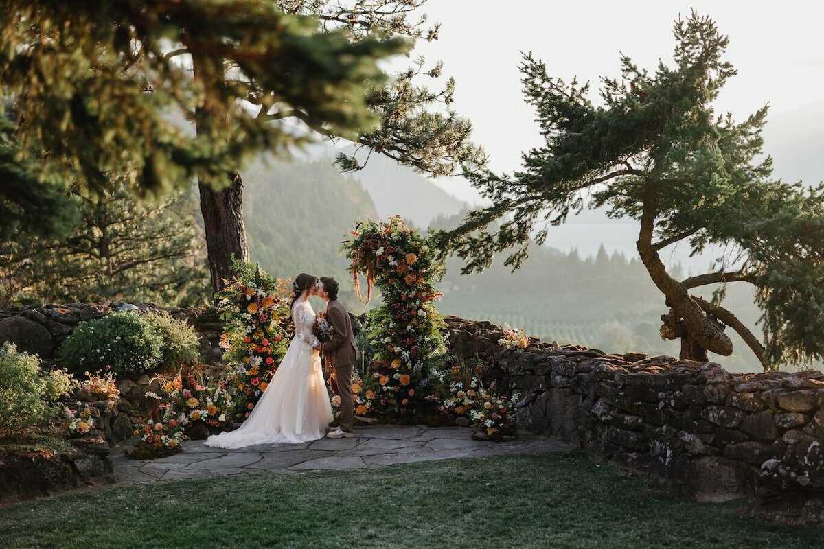 A bride holds her new bride for a bridal portrait in oregon captured by a Hood River Wedding Photographer