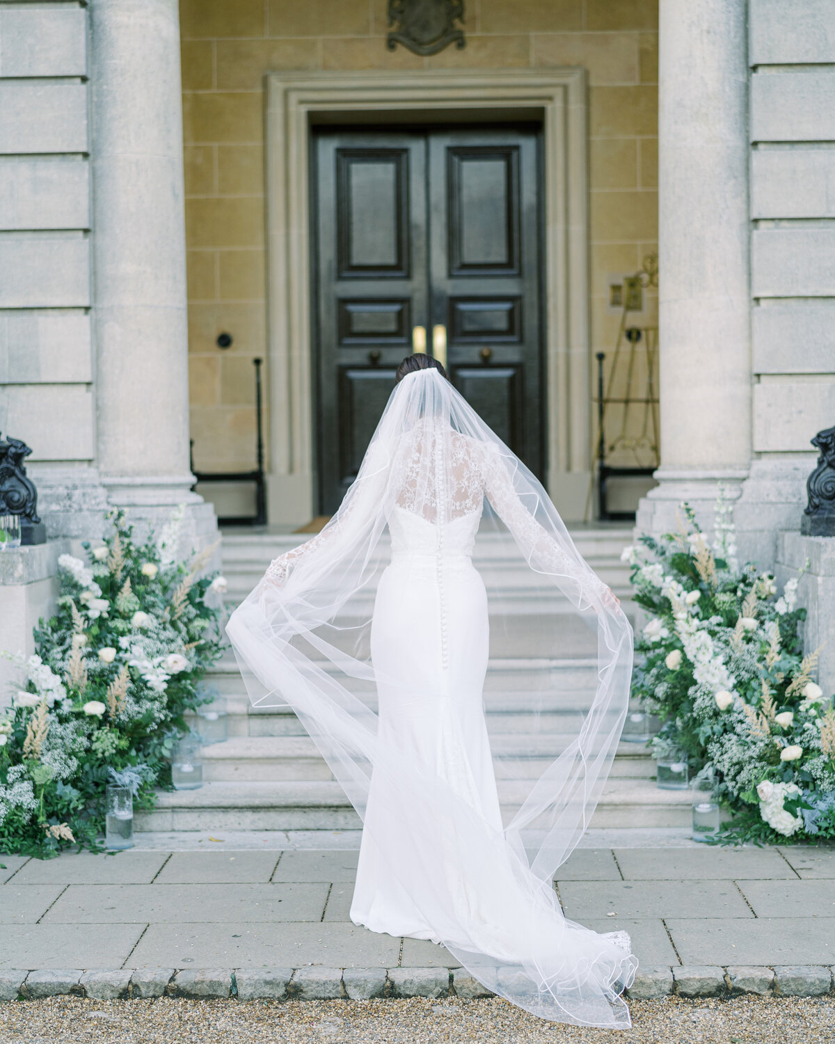 Bridal portrait with floral aisle at Hedsor House